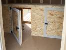8x14 Double Dog Kennel with enclosed feed room dog boxes for weather protection and storage